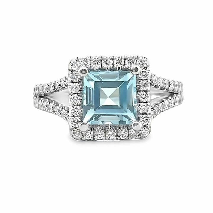 2.02 CT Blue Topaz and 0.75 CT Diamond Halo Split Shank Ring