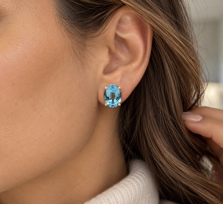 Oval Blue Topaz 14K Yellow Gold Stud Earrings