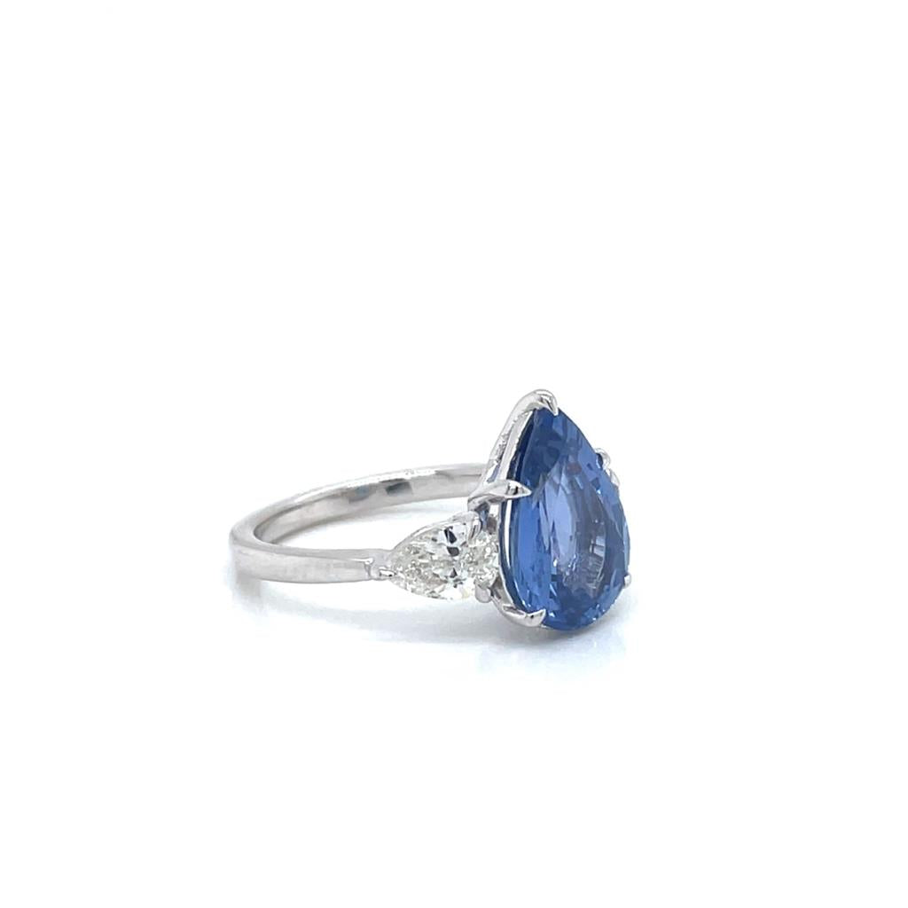 Pear shape sapphire ring with two pear shape side diamonds